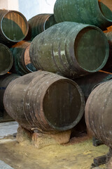 Solera system in old Andalusian wine cellar, process for aging sherry wine in barrels, fino, manzanilla, olorosso, amontillado jerez fortified wine, Sanlucar de Barrameda, Cadiz, Andalusia, Spain