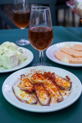 Tasting of sherry wines from barrels, fino, manzanilla, olorosso, amontillado jerez wines with traditional Andalusian tapas in old tavern, Sanlucar de Barrameda, Cadiz, Andalusia, Spain