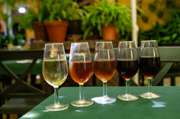 Flight of five sherry wine from barrels, fino, manzanilla, olorosso, amontillado, pedro ximenez jerez wines in old tavern, wine tasting, Sanlucar de Barrameda, Cadiz, Andalusia, Spain