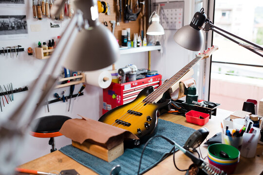 Bass guitar at luthier workshop table