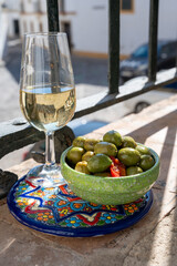 Sherry fino, manzanilla, jerez fortified wine made from palomino white grape served with tapa in...