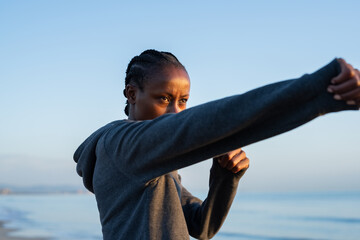 Strong woman practicing fighting skills