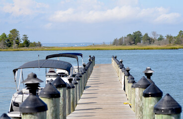 Boat dock pier over water in Chesapeake Bay in Summer