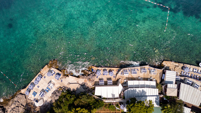 Empty beach club, sunbeds and umbrellas 