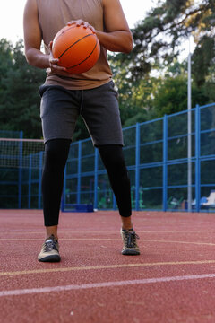 Athlete preparing to perform chest pass during basketball drill