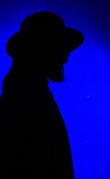 Silhouette of a man in a hat