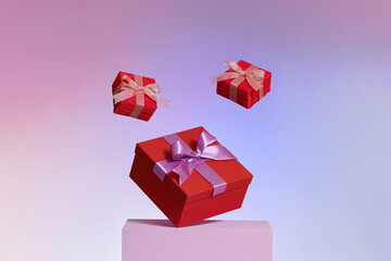 Gift box with purple ribbon and bow on color background