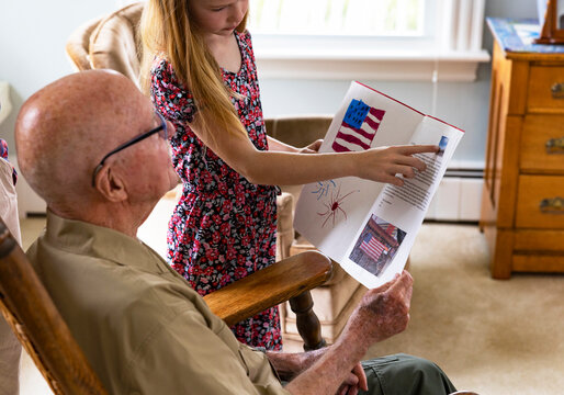 Young Girl hands card portrait thanks veteran day 