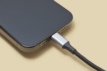 Black wire plugged into socket of turned off cellphone