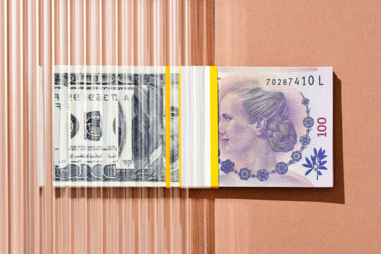 One hundred US dollars to Argentine peso , money. exchange concept