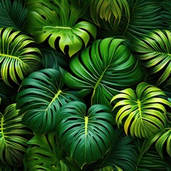 A vibrant arrangement of tropical green leaves creating a lush, natural backdrop.