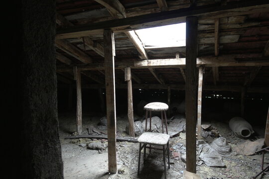 Abandoned Attic with Sunlight Filtering Through Roof
