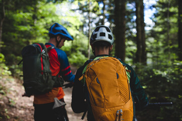 Two riders in Carpathian Mountains prepare to mountain riding.