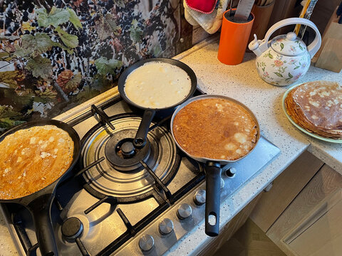 Making pancakes in a cozy kitchen at sunrise