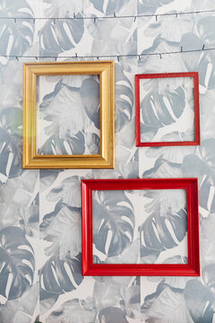 Empty Picture Frames on Patterned Wall