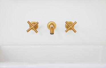 Brass gold hardware faucet on bathroom sink