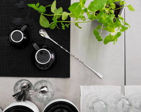 Dishes and mint on the table, ready to use, flat lay