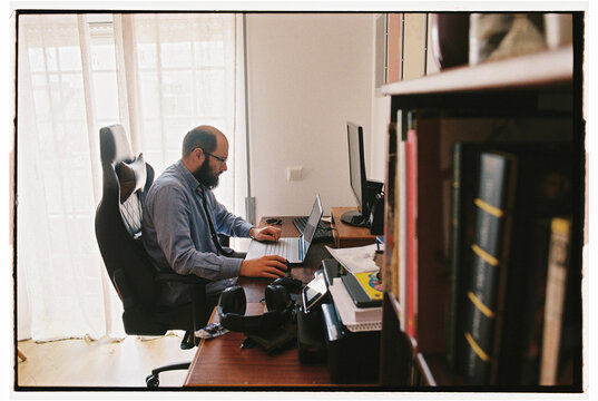 Man working on computer at home