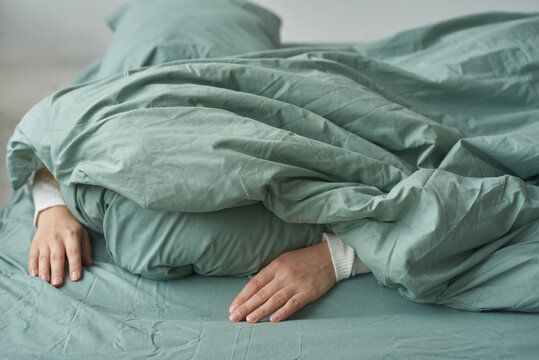 Woman sleeping covered with blanket