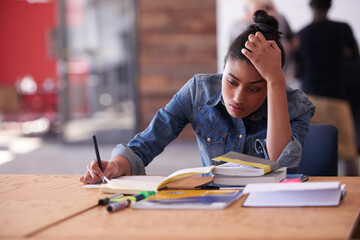 Frustrated girl, student and books with stress for difficult task, studying or assignment at...