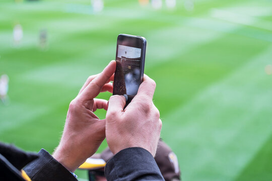 Camera phone being used at a sports stadium