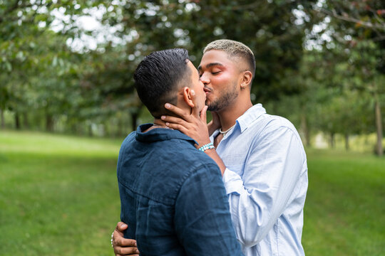Venezuelan gay couple kissing in the park