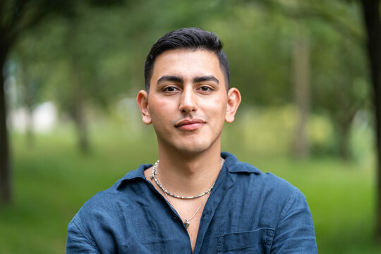 Young venezuelan man posing in a park