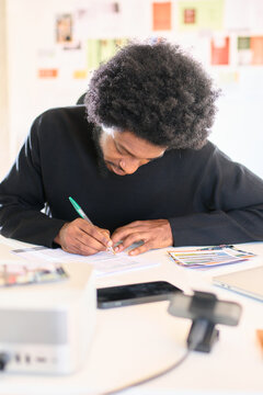 Focused businessman writting