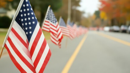 American flags lining the street for a Veterans Day parade, honoring community heroes