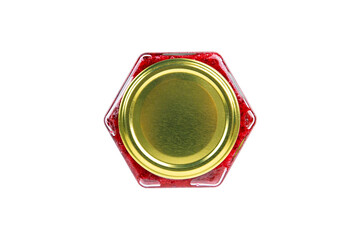 Top view of a hexagonal glass jar with golden lid, filled with vibrant red jam, isolated on white...