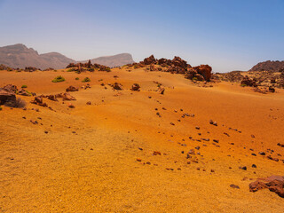 spot in Tenerife with many red rocks and beautiful mountain landscape background