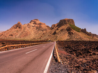 spot in Tenerife with many red rocks and beautiful mountain landscape background