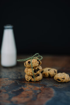 Stack of oat raisin cookies tied with green twine string