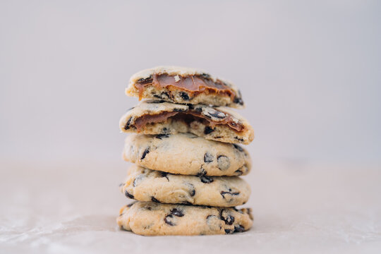 Stack of chocolate cookies with gooey filling showing