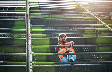 Planning, construction and black woman on site with radio advice, discussion or inspection in low...
