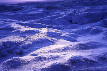 Fototapeta premium Majestic Snowy Landscape at Dusk With Deep Blue Shadows - under the twilight sky, capturing the tranquil beauty of winter and serenity of nature
