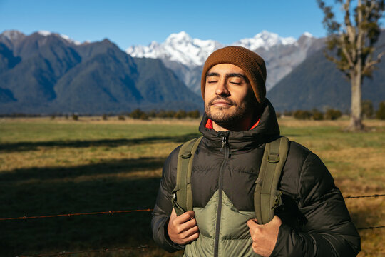 Man feeling the nature in New Zealand in winter