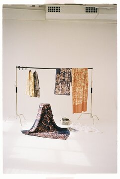 New clothing collection set in studio. Calligraphy art project
