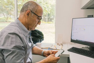 Adult man using his cell phone