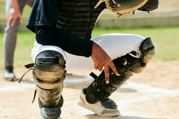 Baseball, hand and catcher on sports field training for game challenge, outdoor exercise or workout in summer. Collaboration, fitness and man in safety gear with secret curve ball gesture for team