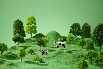 Toy miniature landscapes. landscape layout with cows
