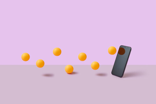 Orange balls bouncing off surface towards mobile phone screen