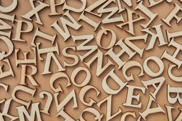 Letters of english alphabet scattered randomly in studio
