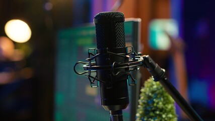Empty desk equipped with mixing console and music recording tools in home studio, professional...