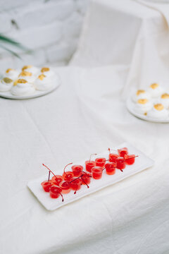 Decorative plate of red cherries with white background