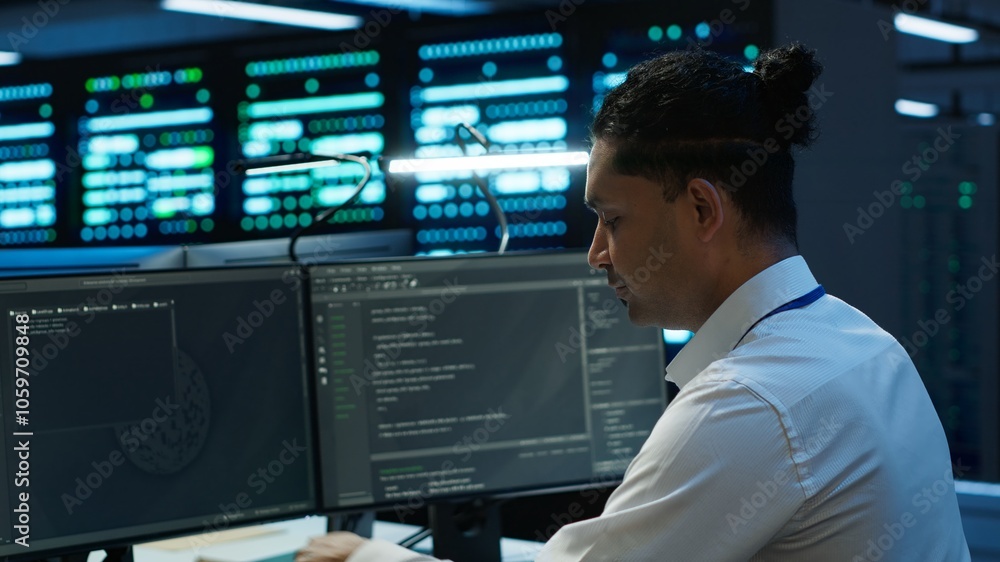 Poster system administrator in data center maintaining accurate paperwork of hardware, generating reports. 