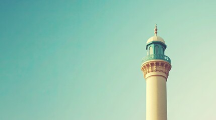 Low-angle view of a minaret against a clear sky, blank copy space