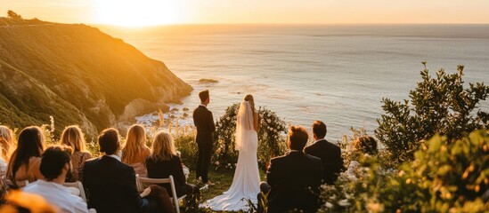 A bride and groom stand at the alter with their guests as they exchange vows at sunset, overlooking the ocean.