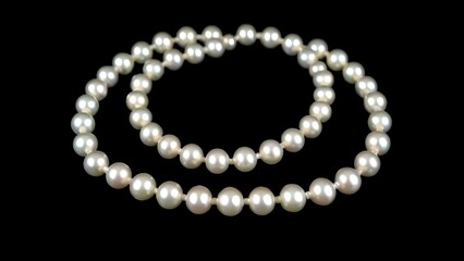 Obraz premium Pearl Necklace on Black Background