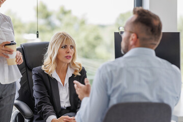 Business Meeting Discussion in a Modern Office Setting